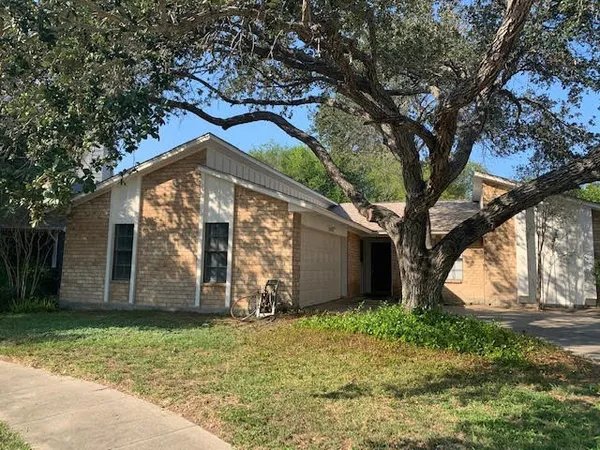 a front view of house with garden