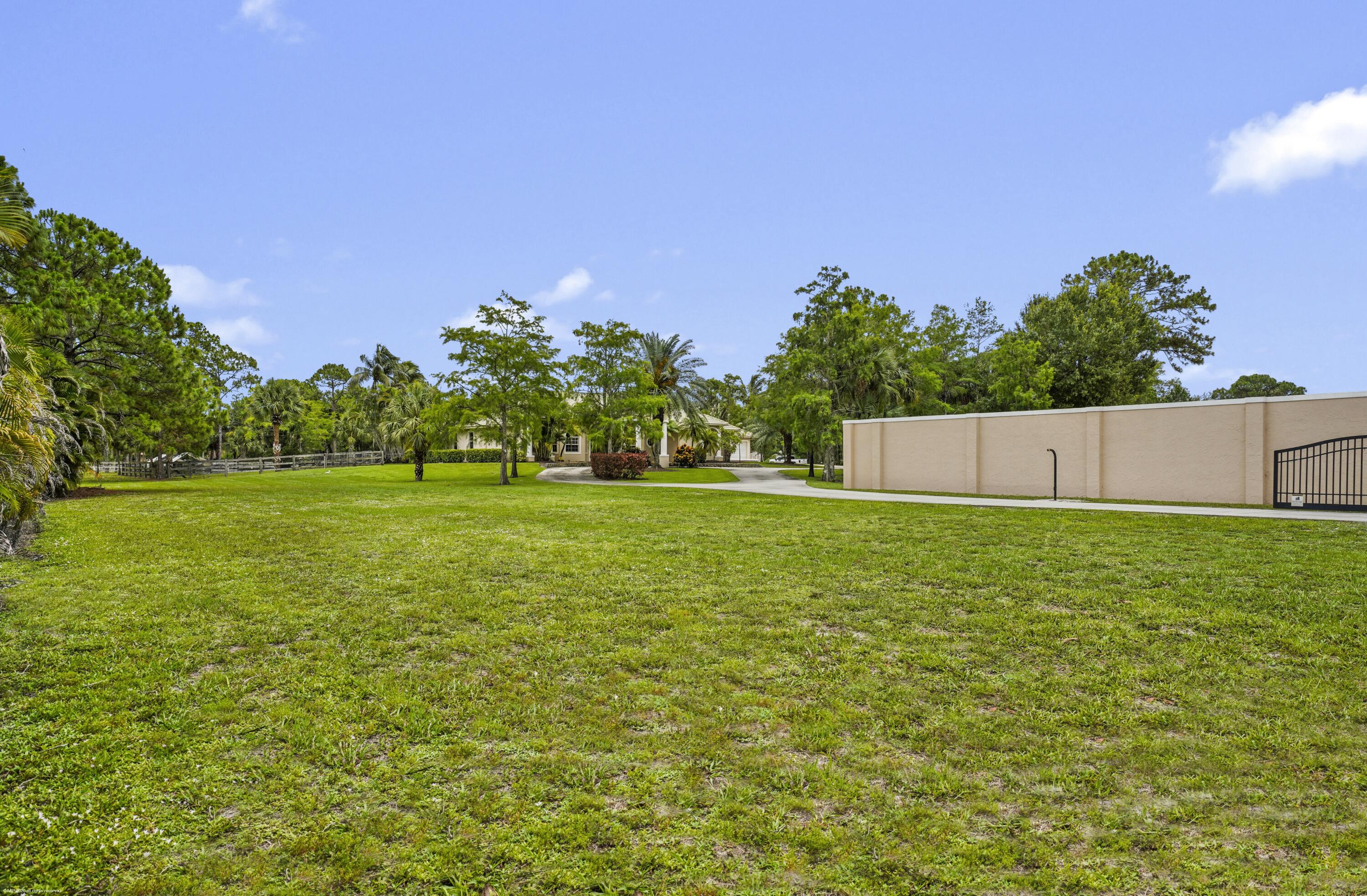 2560 Buck Ridge Trail Loxahatchee, FL 33470 - Photo 63 of 65 More green open space for paddock