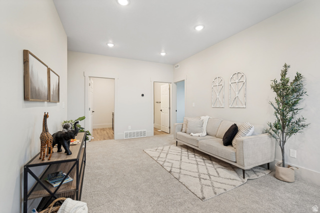 529 North Hvn Drive Mapleton, UT 84664 - Photo 20 of 30 Spacious room with light neutral wall tones, recessed ceiling lighting, and soft gray carpeting