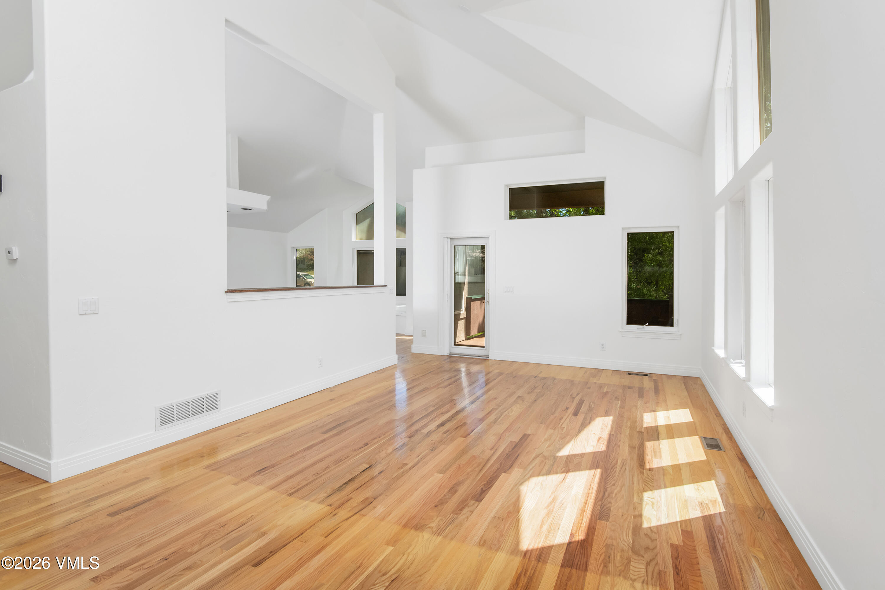 471 Rawhide Road Edwards, CO 81632 - Photo 9 of 51 a view of an empty room with wooden floor and a window