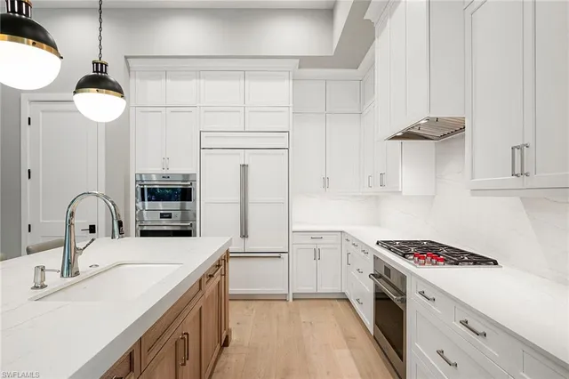 a kitchen with a table and chairs in it