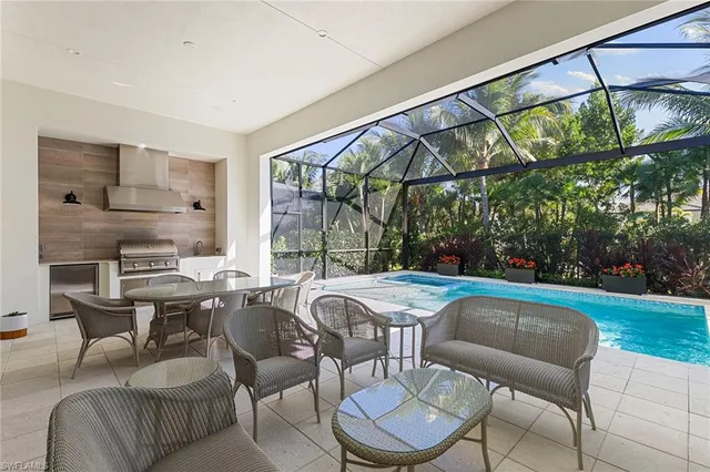 a kitchen with a stove and white cabinets