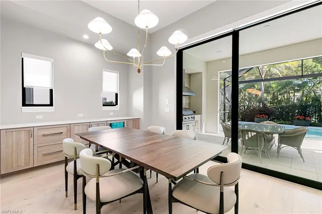 a kitchen with a table and chairs in it