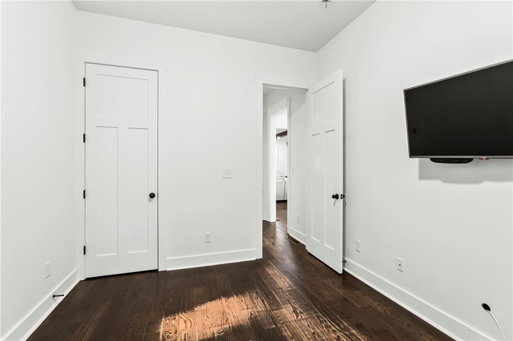 1771 Derry Avenue Southwest Atlanta, GA 30310 - Photo 20 of 45 a view of room with wooden floor and flat screen tv