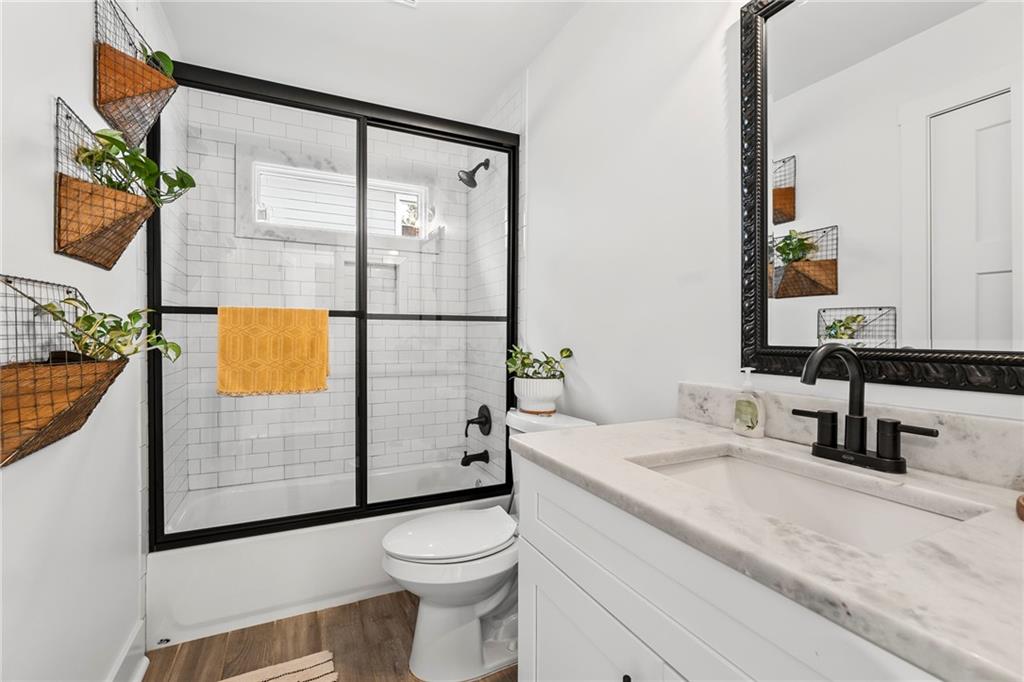1771 Derry Avenue Southwest Atlanta, GA 30310 - Photo 31 of 45 a bathroom with a sink a toilet and shower
