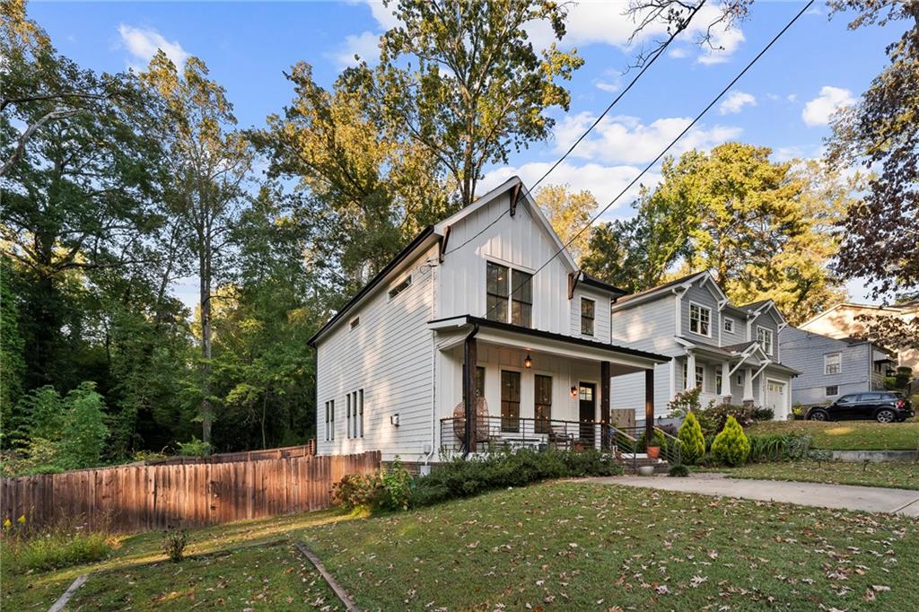 1771 Derry Avenue Southwest Atlanta, GA 30310 - Photo 9 of 45 a front view of a house with a yard and potted plants
