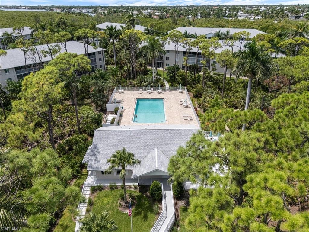 3012 Sandpiper Bay Circle, Unit D101 Naples, FL 34112 - Photo 22 of 27 an aerial view of a house with a yard
