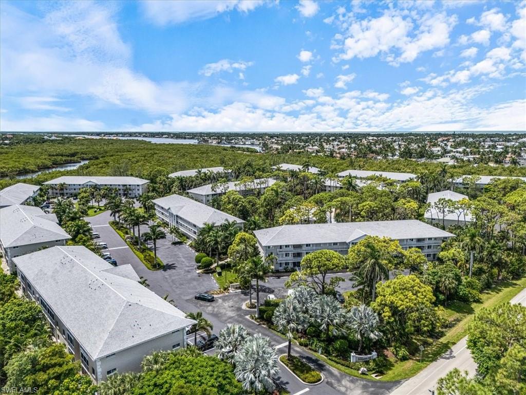 3012 Sandpiper Bay Circle, Unit D101 Naples, FL 34112 - Photo 23 of 27 a view of a city with an ocean
