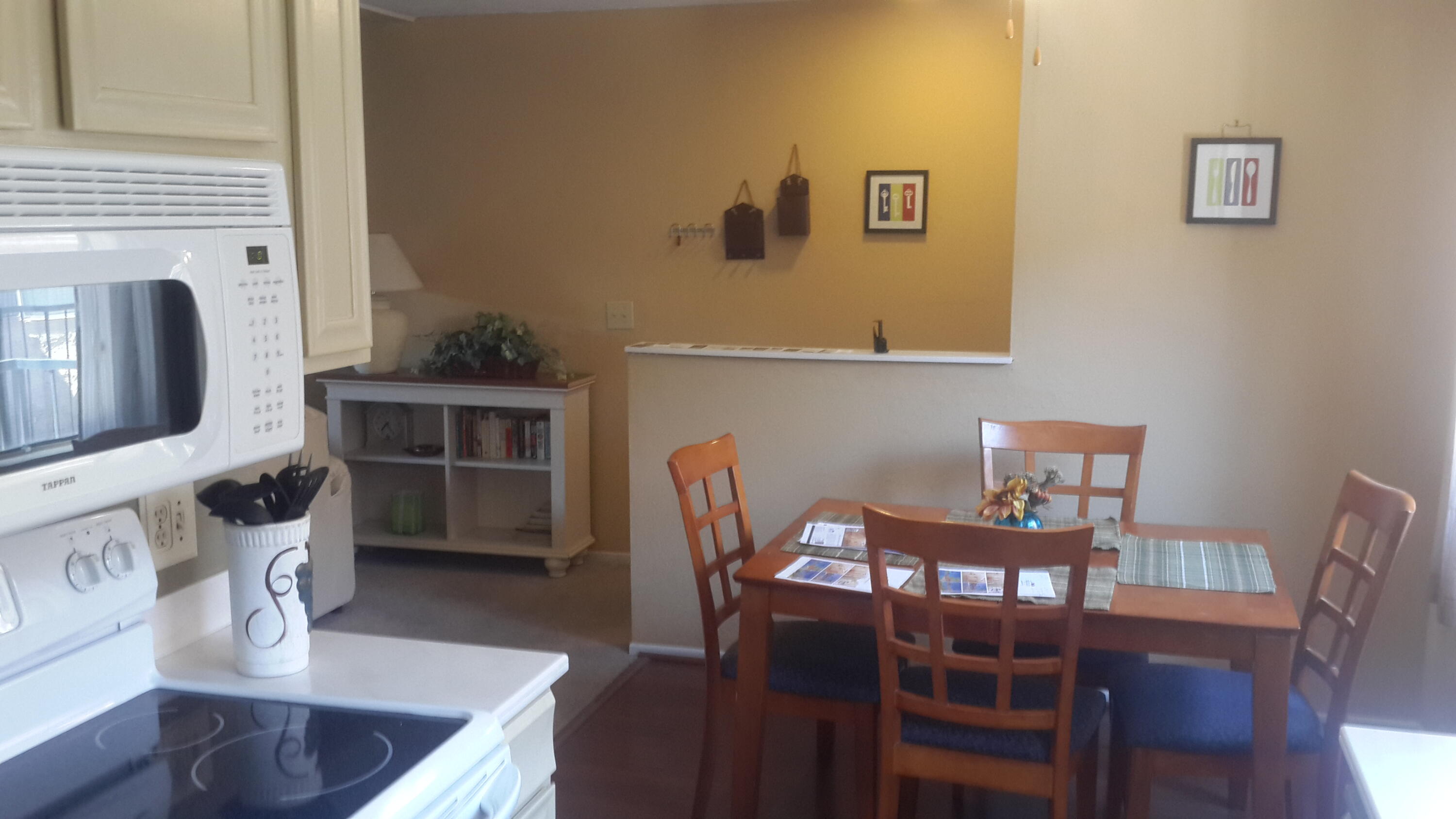 1050 Ramon Road, Unit 78 Palm Springs, CA 92264 - Photo 1 of 6 a view of a dining room with furniture and wooden floor