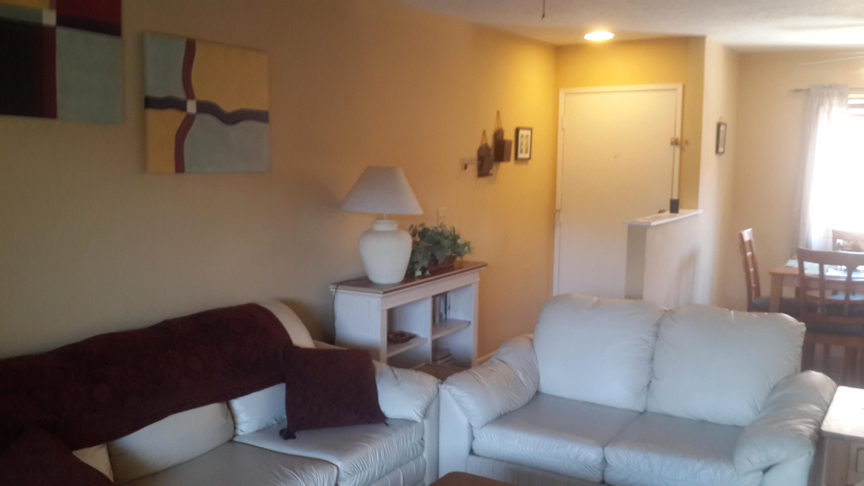 1050 Ramon Road, Unit 78 Palm Springs, CA 92264 - Photo 3 of 6 a living room with furniture and a wooden floor