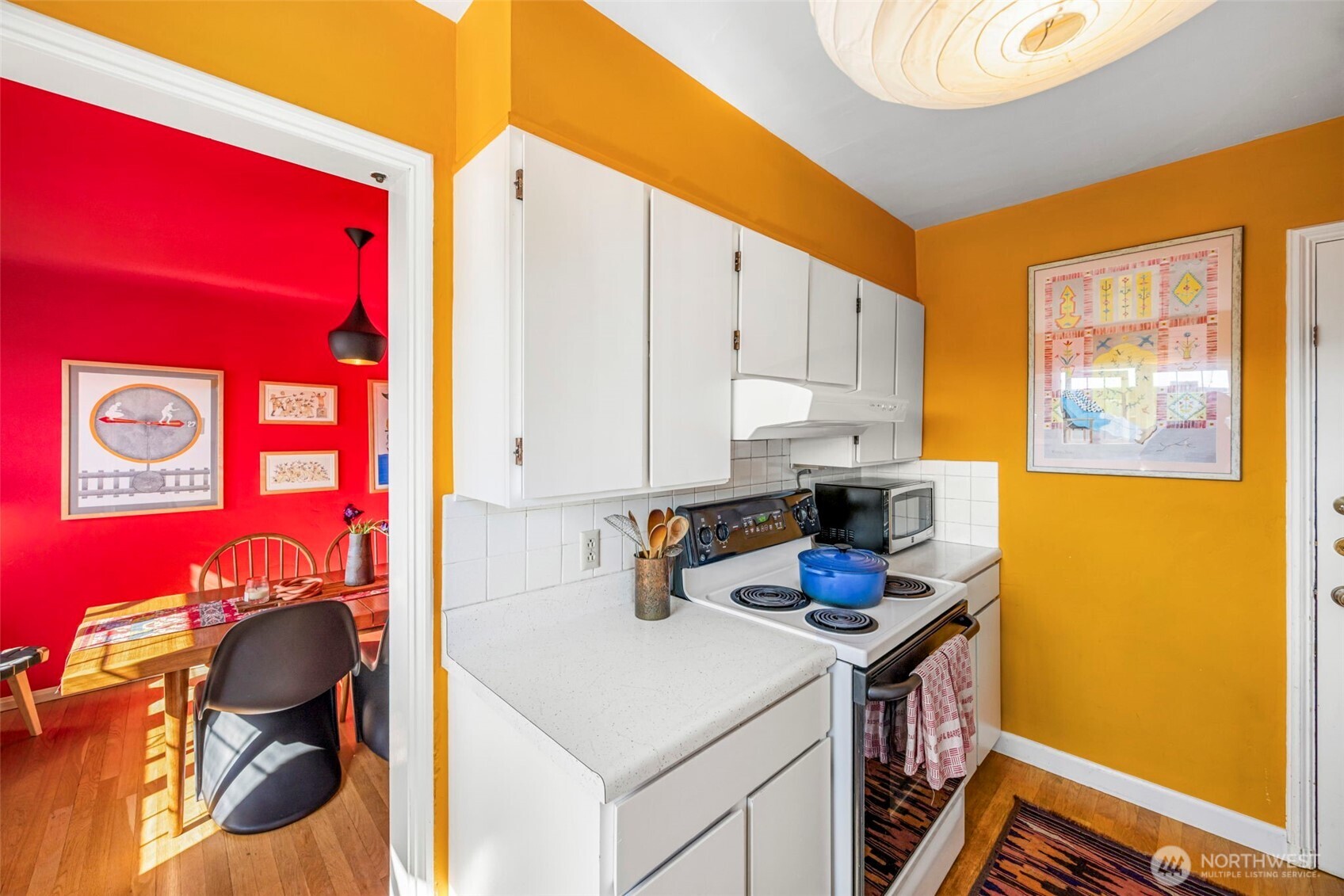 1014 East Roy Street, Unit 35 Seattle, WA 98102 - Photo 8 of 18 a kitchen with stainless steel appliances granite countertop a stove and a refrigerator