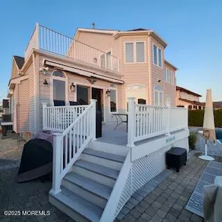 a view of a house with wooden floor and a yard