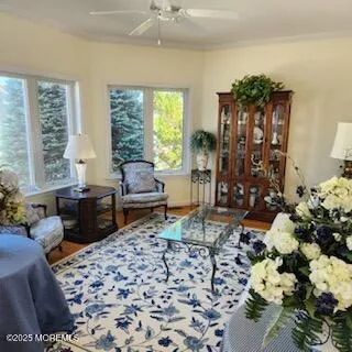 a living room with furniture and a floor to ceiling window