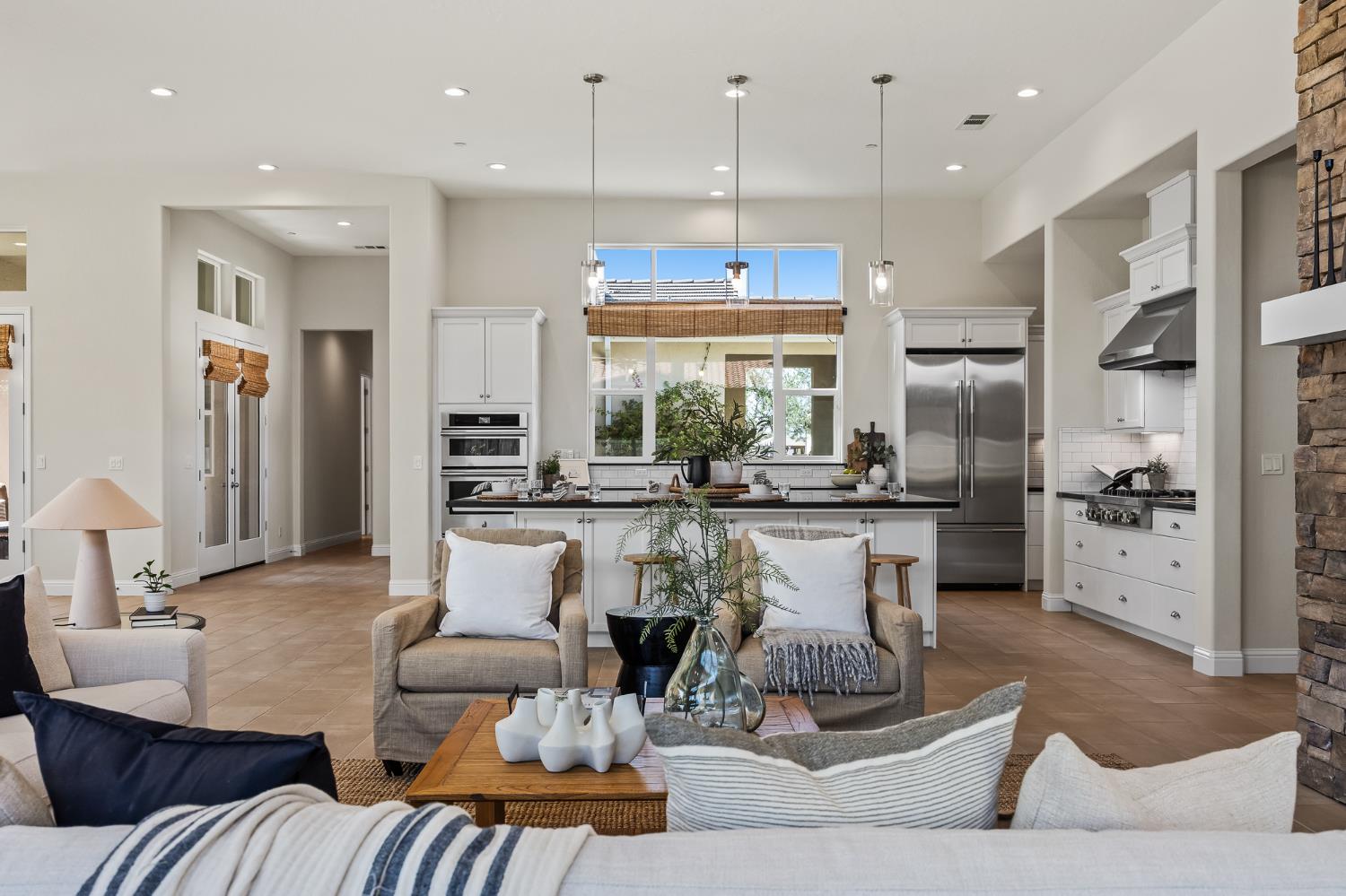 998 Highland Road West Madera, CA 93636 - Photo 17 of 61 a living room with furniture kitchen and a large window
