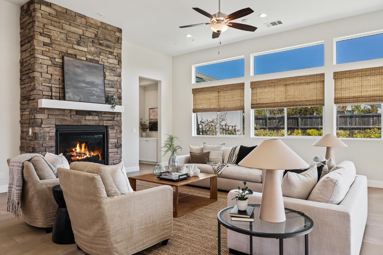 998 Highland Road West Madera, CA 93636 - Photo 19 of 61 a living room with furniture fireplace and a large window