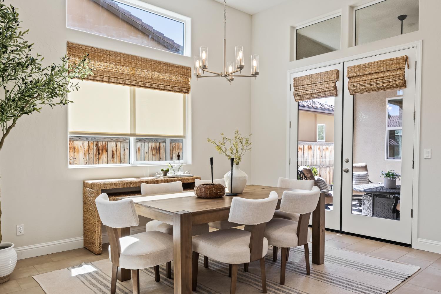 998 Highland Road West Madera, CA 93636 - Photo 28 of 61 a view of a dining room with furniture large windows and wooden floor