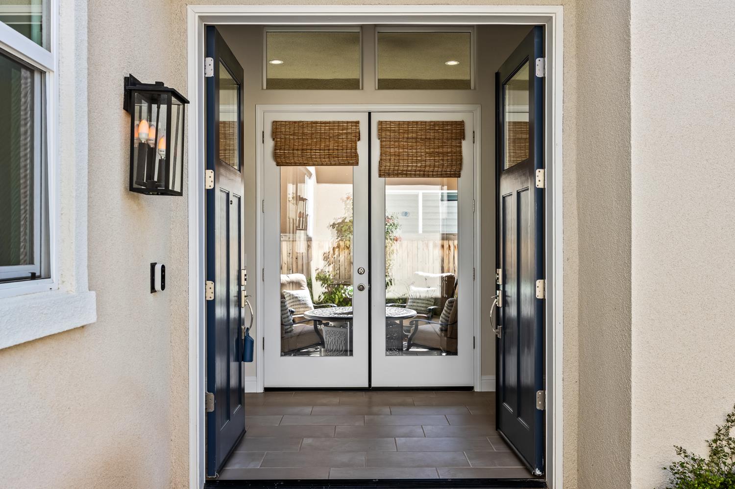 998 Highland Road West Madera, CA 93636 - Photo 29 of 61 a view of a hallway with a glass door and couch
