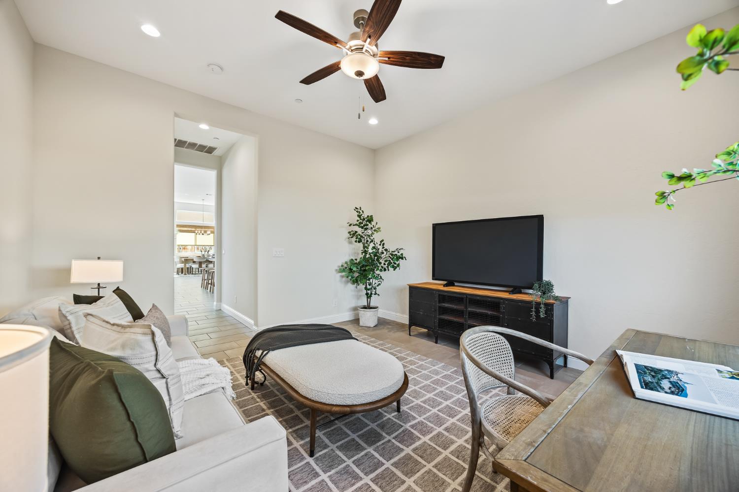998 Highland Road West Madera, CA 93636 - Photo 33 of 61 a living room with furniture a flat screen tv and a window