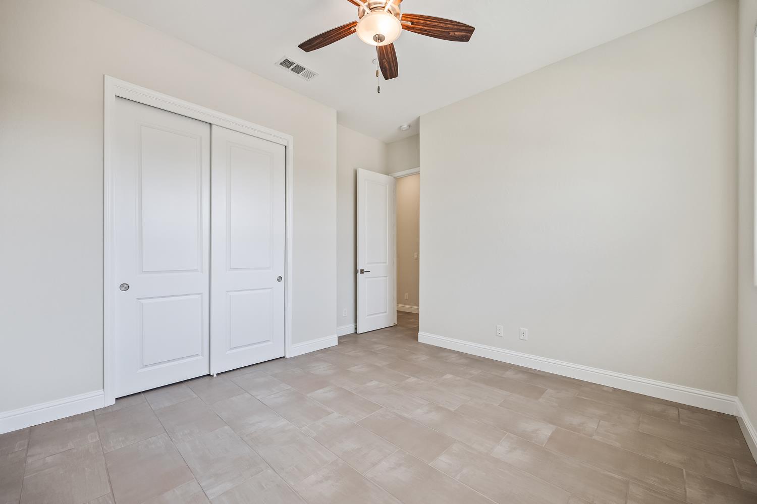 998 Highland Road West Madera, CA 93636 - Photo 40 of 61 a view of an empty room and chandelier fan
