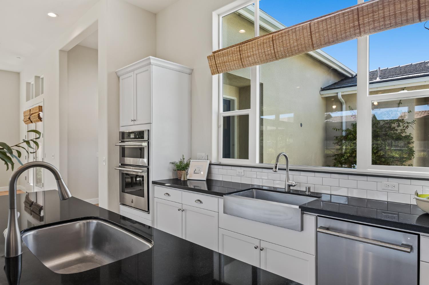 998 Highland Road West Madera, CA 93636 - Photo 4 of 61 a kitchen with granite countertop a sink and cabinets