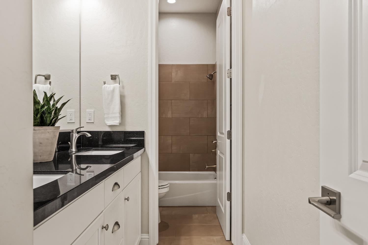 998 Highland Road West Madera, CA 93636 - Photo 45 of 61 a bathroom with a sink and a shower