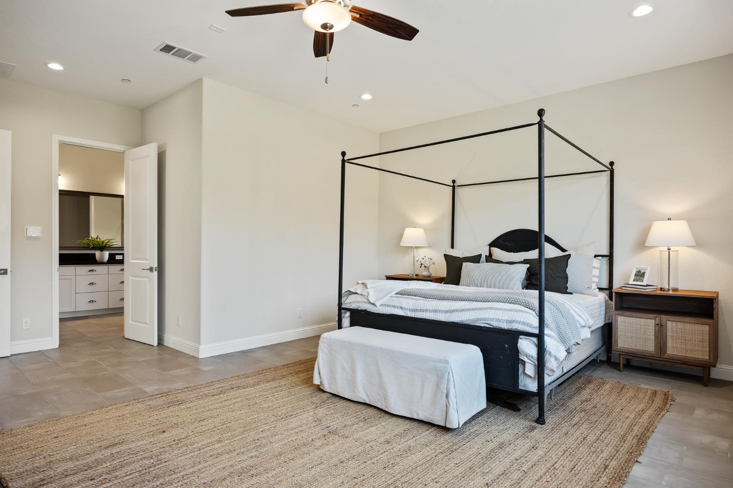 998 Highland Road West Madera, CA 93636 - Photo 51 of 61 a bedroom with a bed and a chandelier