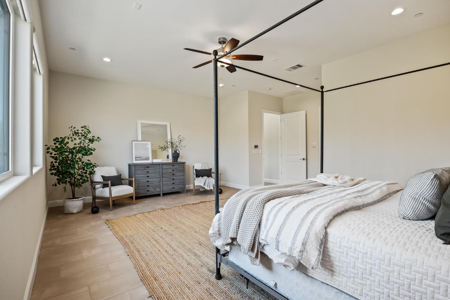 998 Highland Road West Madera, CA 93636 - Photo 52 of 61 a bedroom with a balcony a bed and a couch