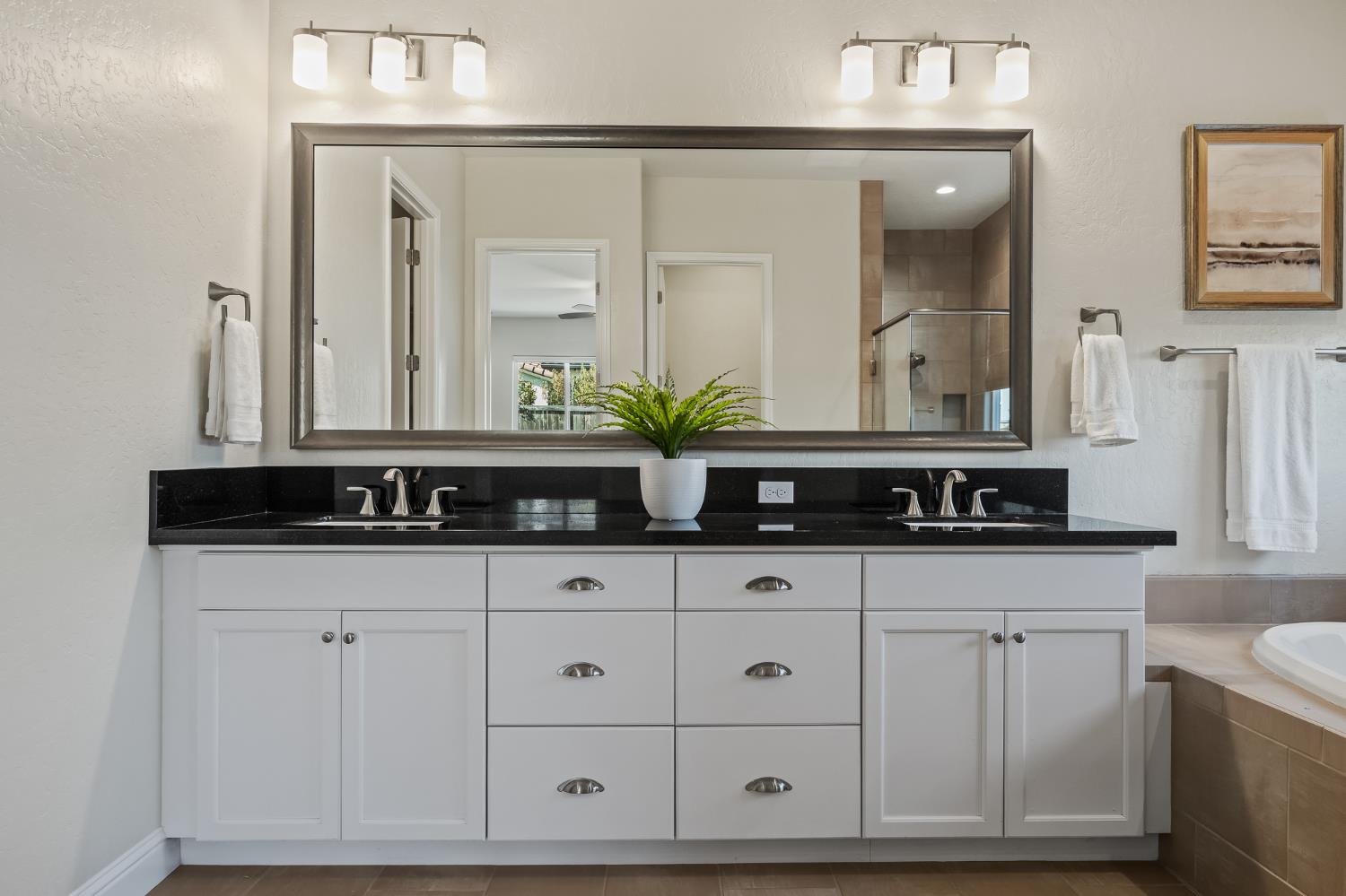 998 Highland Road West Madera, CA 93636 - Photo 55 of 61 a bathroom with white cabinets a sink and a mirror