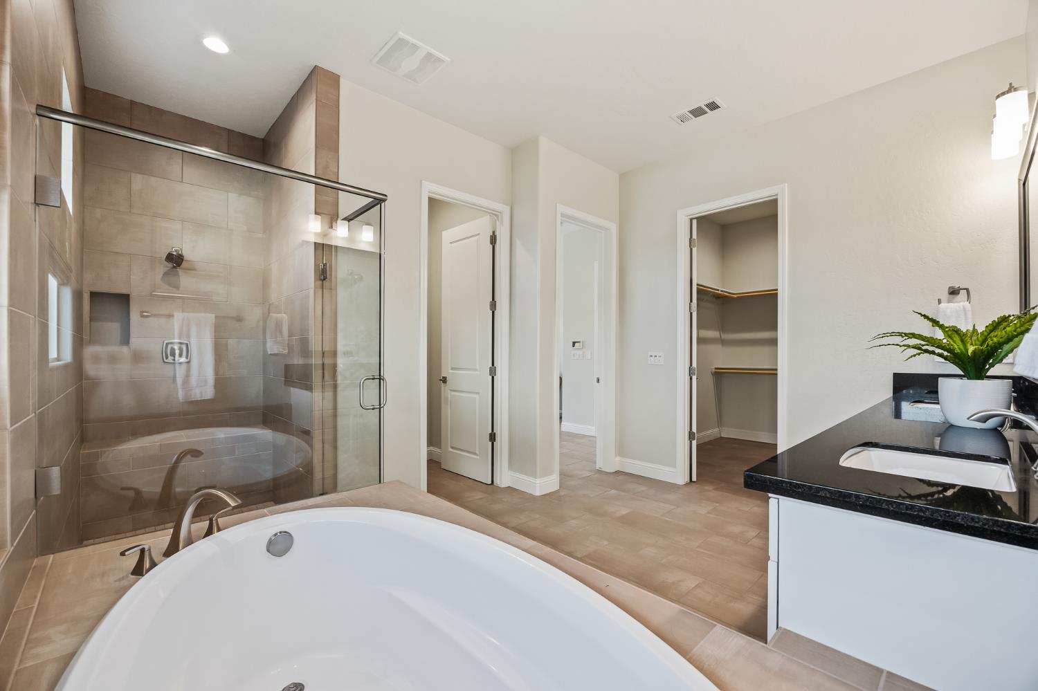 998 Highland Road West Madera, CA 93636 - Photo 57 of 61 a bathroom with a granite countertop sink a mirror and a shower