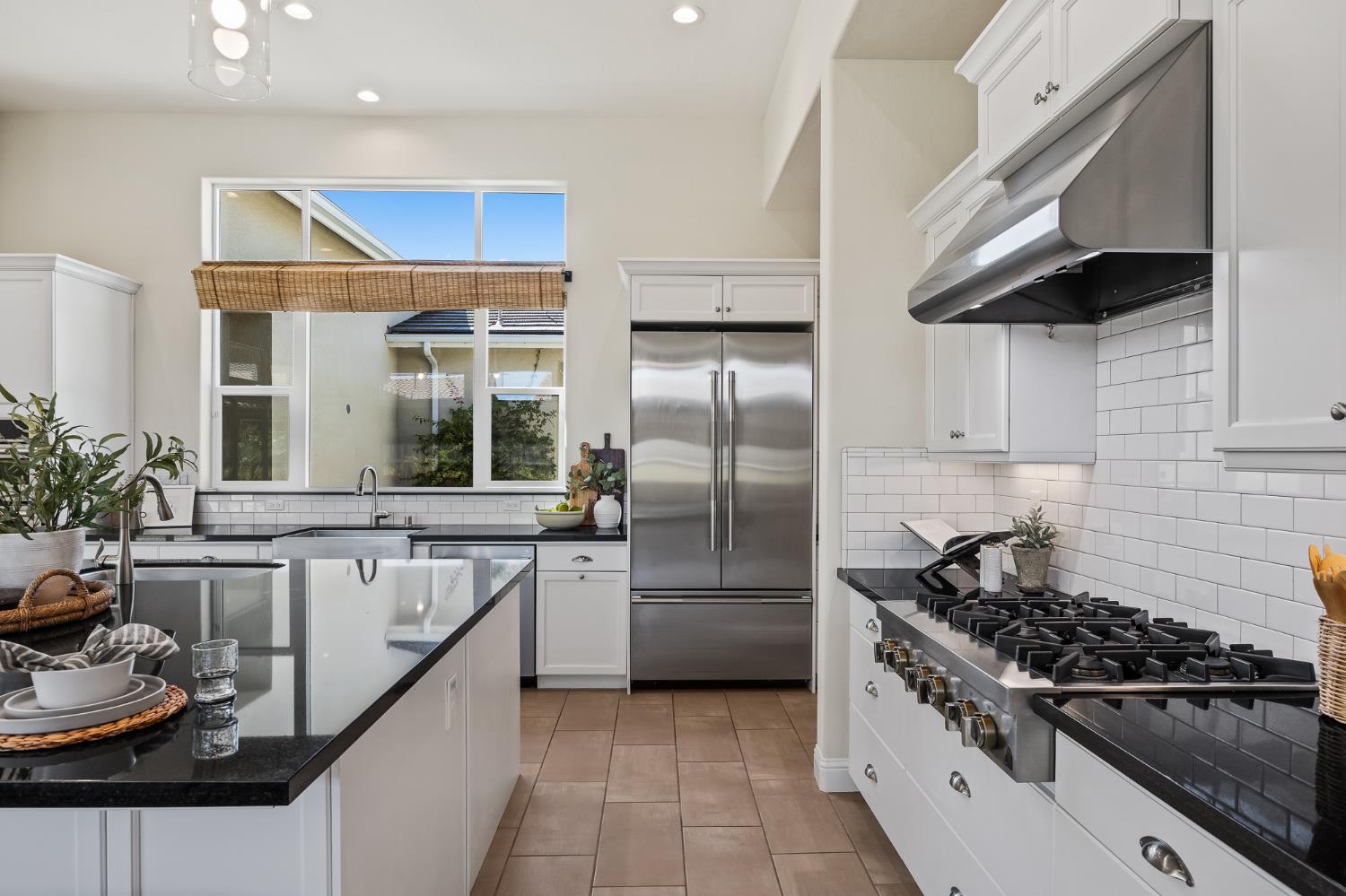 998 Highland Road West Madera, CA 93636 - Photo 7 of 61 a kitchen with stainless steel appliances granite countertop a sink a stove and a refrigerator