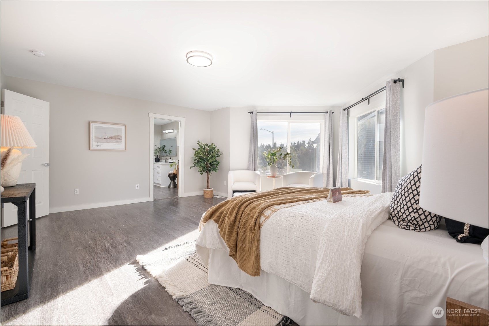 15030 38th Drive Southeast Bothell, WA 98012 - Photo 21 of 37 a spacious bedroom with a bed and wooden floor