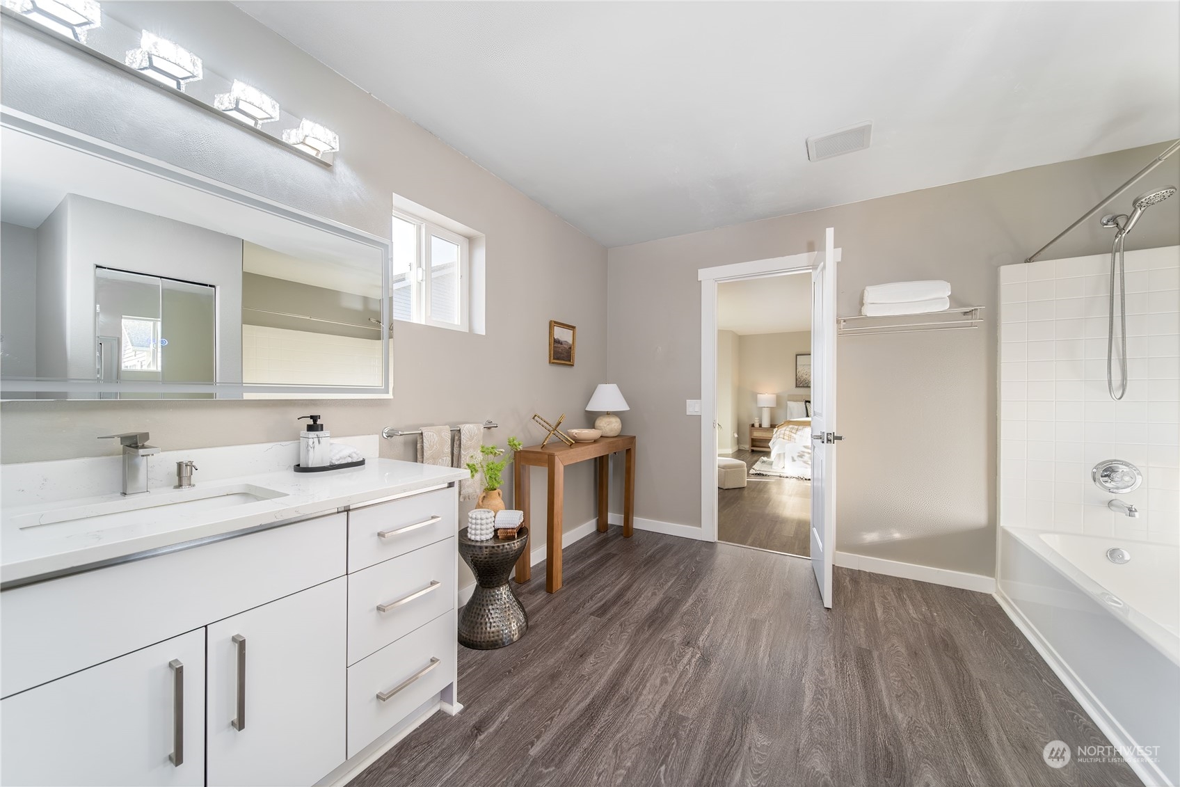 15030 38th Drive Southeast Bothell, WA 98012 - Photo 24 of 37 a kitchen with a sink cabinets and wooden floor