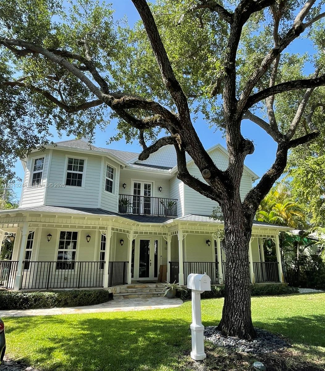 5000 Southwest 73rd Terrace Miami, FL 33143 - Photo 1 of 24 a front view of a house with garden