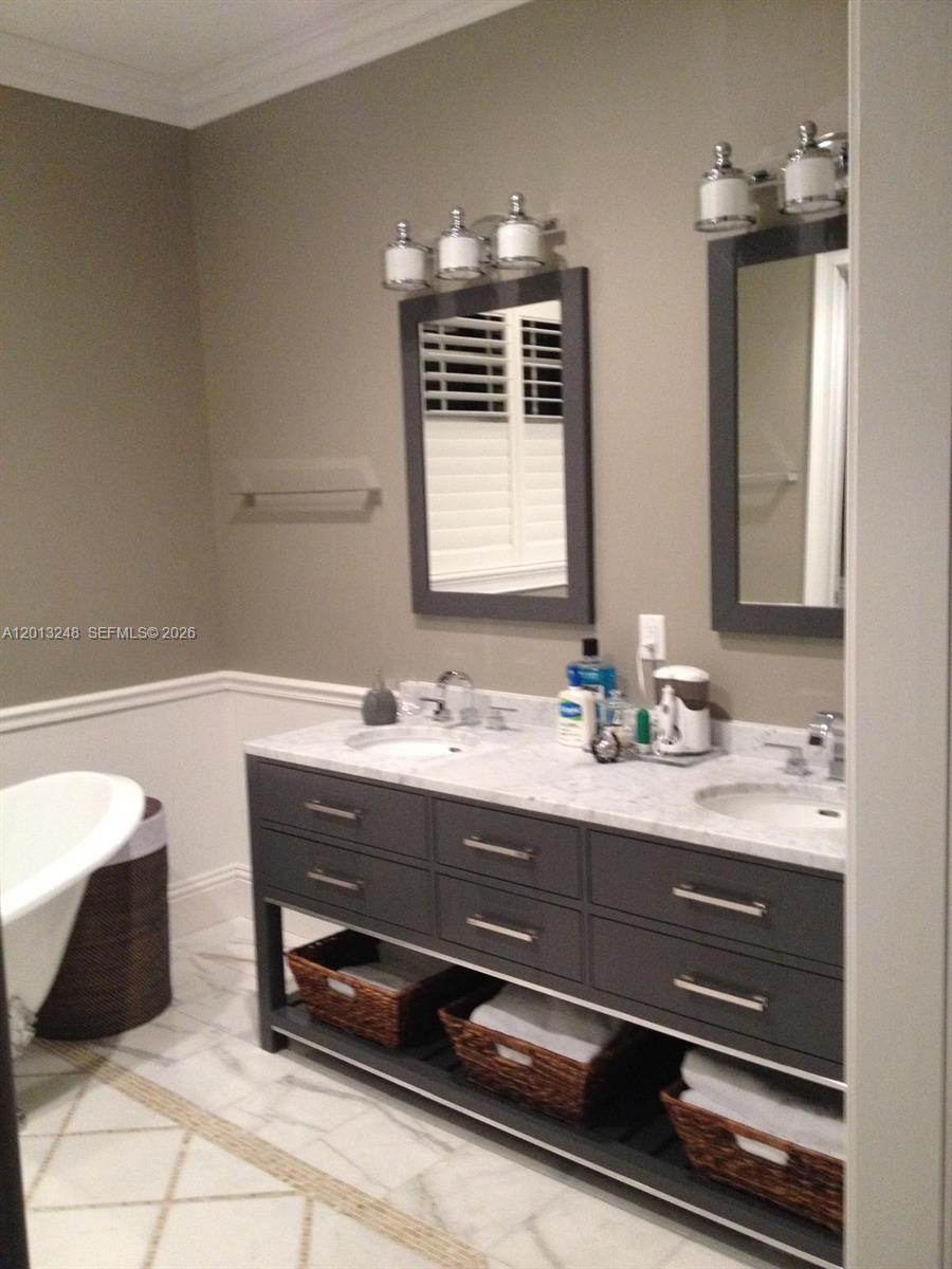 5000 Southwest 73rd Terrace Miami, FL 33143 - Photo 13 of 24 a bathroom with a sink a vanity and a mirror
