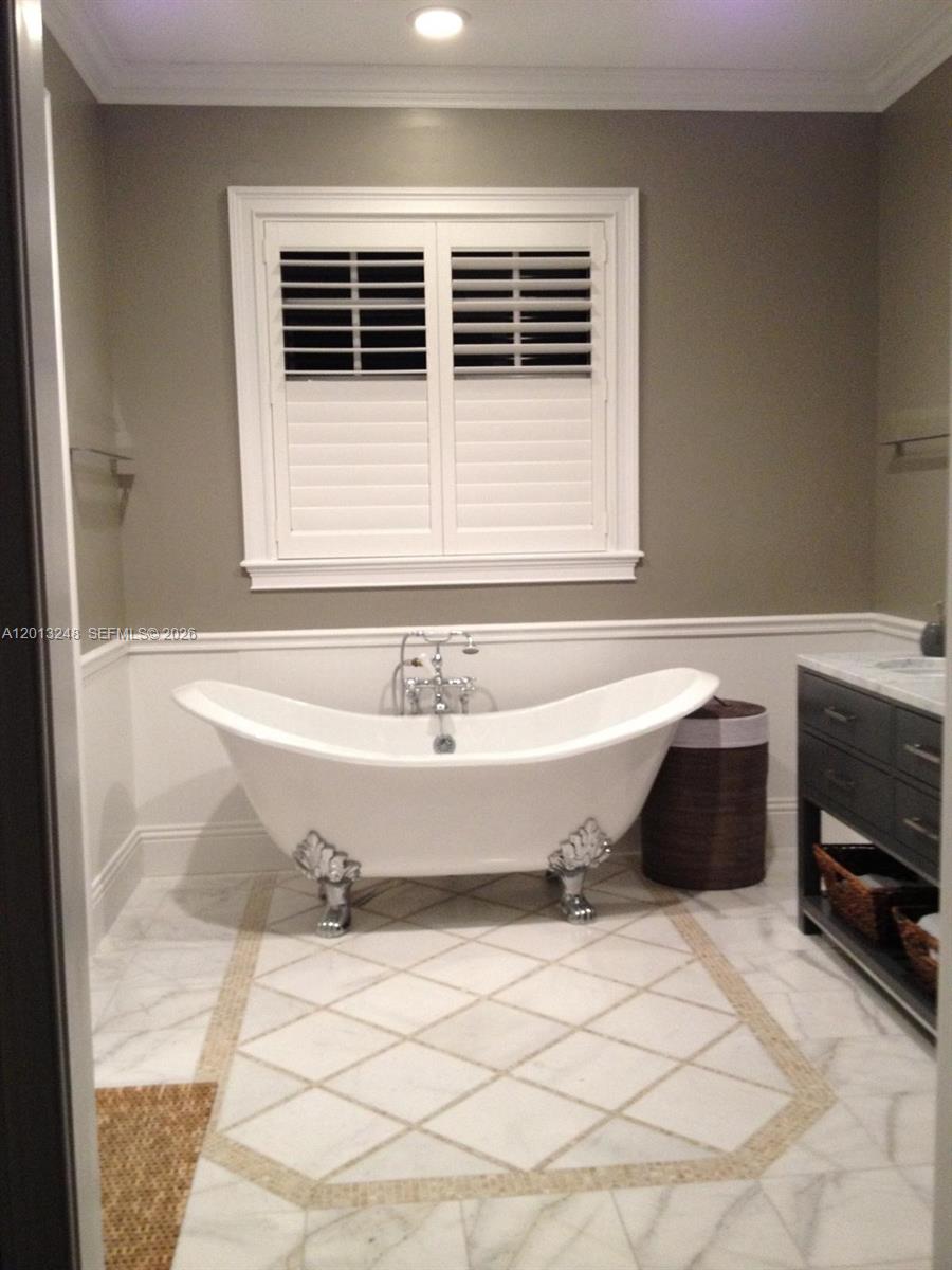 5000 Southwest 73rd Terrace Miami, FL 33143 - Photo 14 of 24 a bathroom with a bathtub and a window