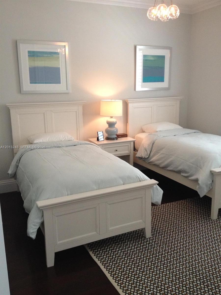 5000 Southwest 73rd Terrace Miami, FL 33143 - Photo 15 of 24 a bedroom with a bed and a lamp on dresser
