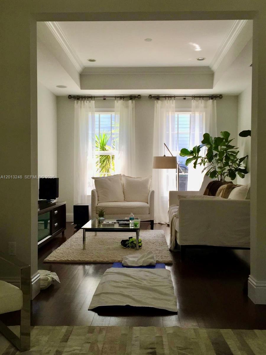 5000 Southwest 73rd Terrace Miami, FL 33143 - Photo 2 of 24 a living room with furniture and a flat screen tv
