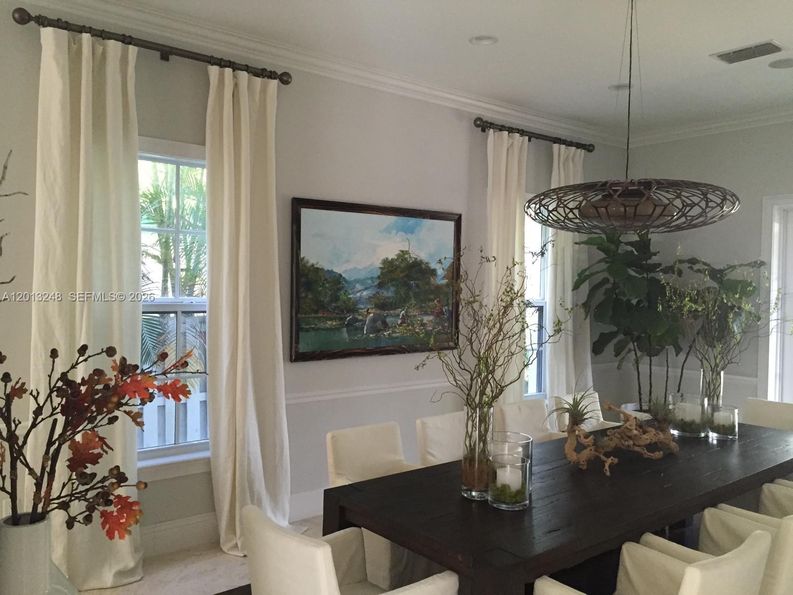 5000 Southwest 73rd Terrace Miami, FL 33143 - Photo 6 of 24 a living room with furniture and flowers