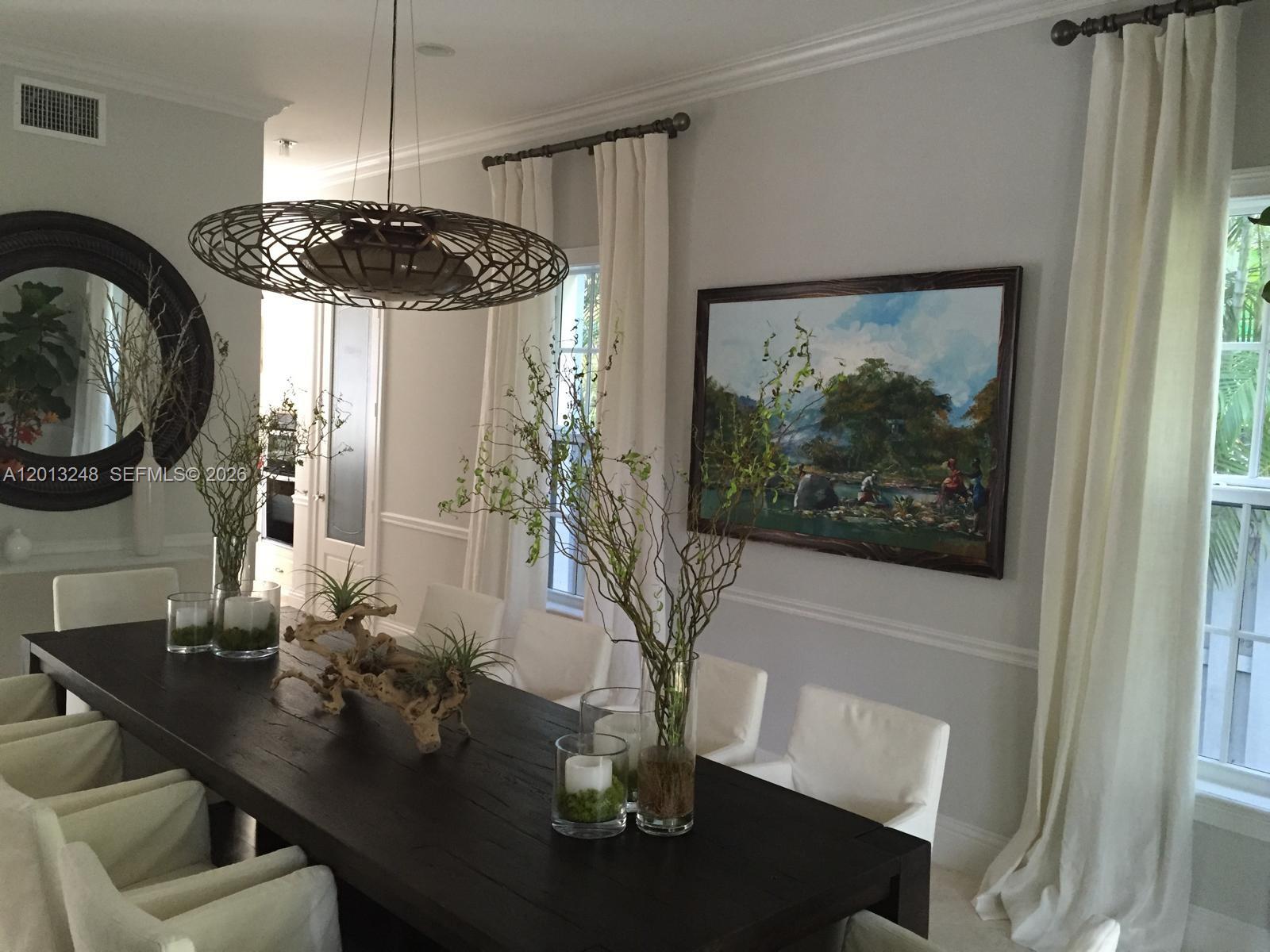 5000 Southwest 73rd Terrace Miami, FL 33143 - Photo 7 of 24 a view of a dining room with furniture window and wooden floor