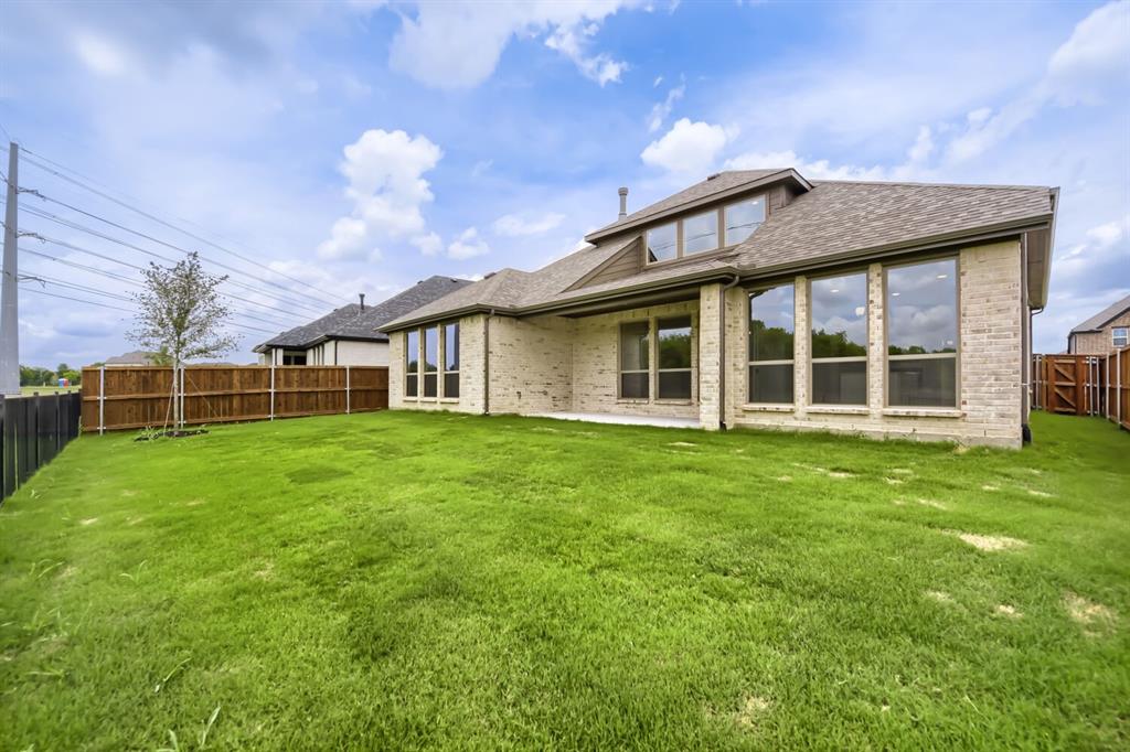 11465 Wulstone Road Fort Worth, TX 76052 - Photo 27 of 27 Expansive backyard featuring a large grass lawn