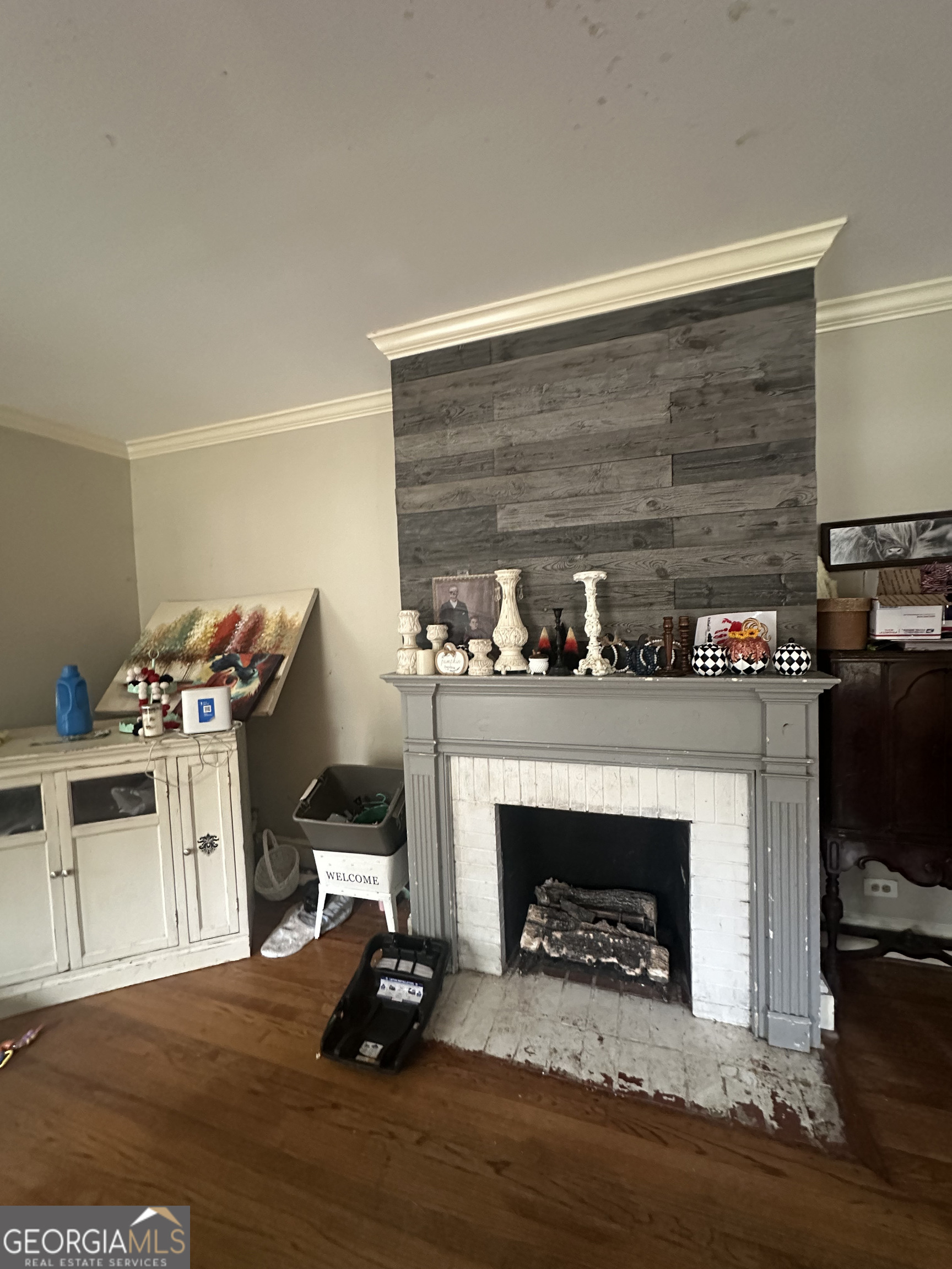 108 Charlton Street Northwest Rome, GA 30165 - Photo 7 of 7 a living room with furniture and a fireplace
