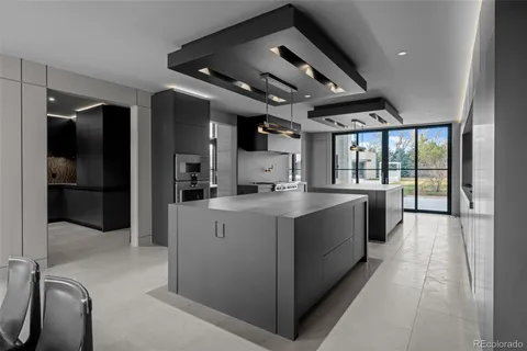 a kitchen with a table and chairs in it