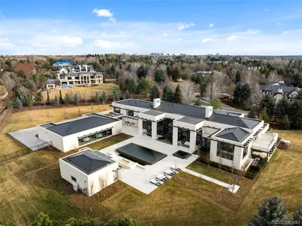 a view of a swimming pool with outdoor seating