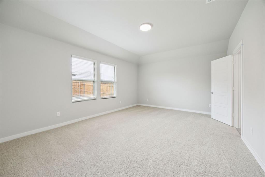657 Poppy Lane Lavon, TX 75166 - Photo 15 of 28 an empty room with windows