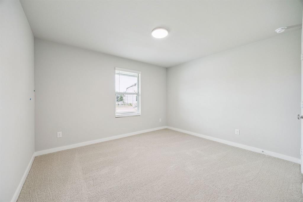 657 Poppy Lane Lavon, TX 75166 - Photo 22 of 28 an empty room with windows