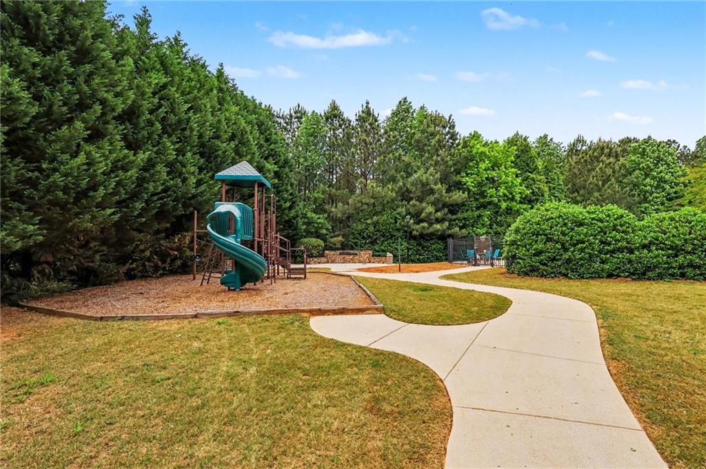 2780 Lakeview Walk Decatur, GA 30035 - Photo 30 of 37 a view of a swimming pool with an outdoor space and seating area