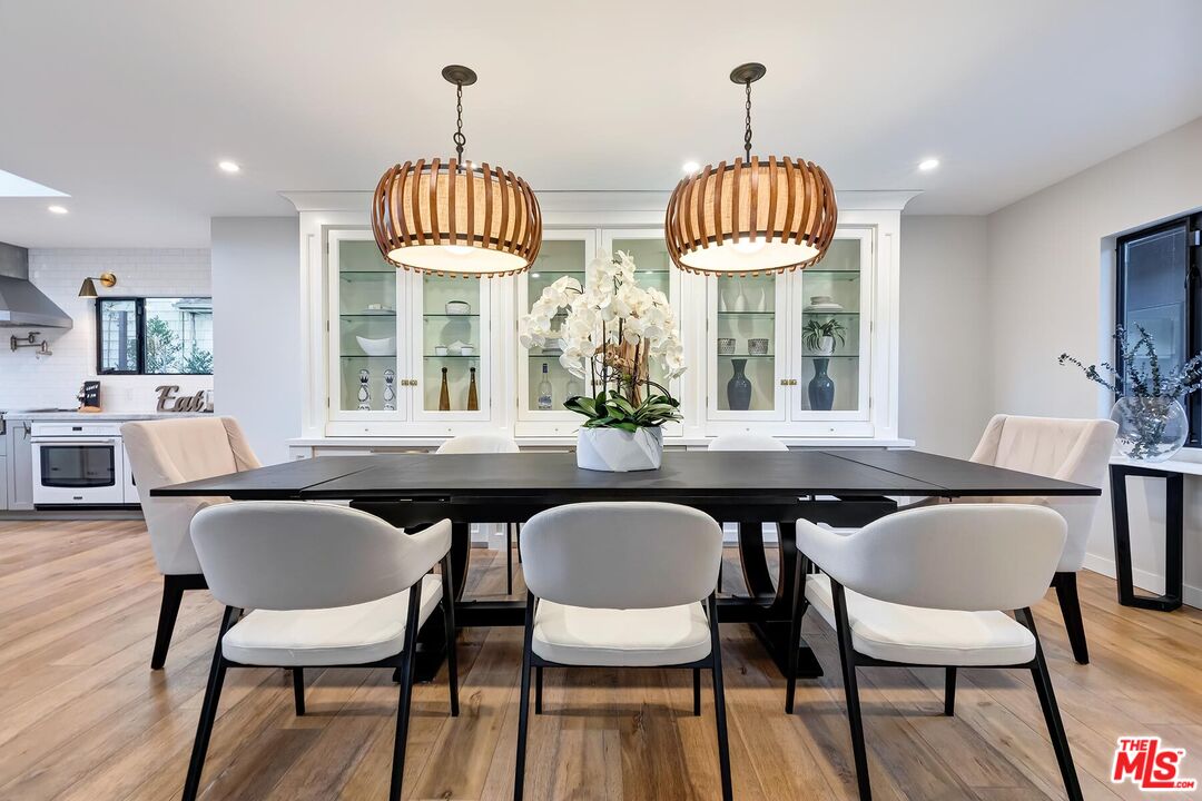 5401 Ostrom Avenue Encino, CA 91316 - Photo 20 of 73 a dining room with furniture and window
