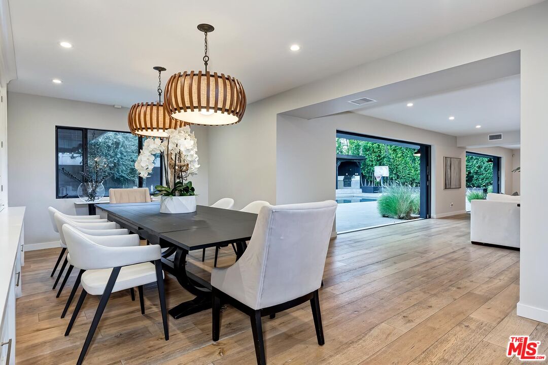 5401 Ostrom Avenue Encino, CA 91316 - Photo 21 of 73 a view of a dining room with furniture window and outside view