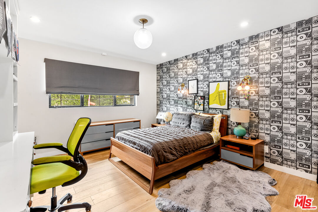 5401 Ostrom Avenue Encino, CA 91316 - Photo 38 of 73 a bedroom with a bed and a couch