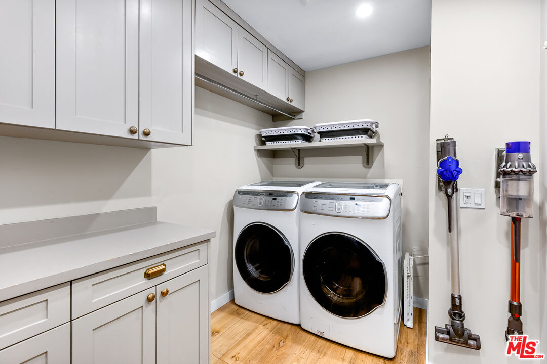 5401 Ostrom Avenue Encino, CA 91316 - Photo 42 of 73 a utility room with dryer and washer